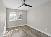 Thumbnail 13 of 64 - bedroom with ceiling fan at Ocean Breeze Terrace Apartment, Huntington Beach, CA, 92648