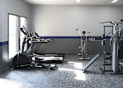 Thumbnail 26 of 27 - A gym with a variety of equipment including treadmills, weights, and exercise machines.