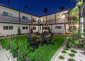 Thumbnail 37 of 64 - Courtyard seating at Ocean Breeze Terrace Apartment, Huntington Beach, California