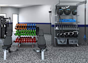Thumbnail 24 of 27 - A gym with a variety of equipment including weights and resistance bands.