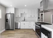 Thumbnail 18 of 64 - renovated kitchen at Ocean Breeze Terrace Apartment, California