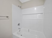 Thumbnail 5 of 18 - a white bathroom at Wescove Apartments, West Covina, 91790