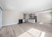 Thumbnail 2 of 18 - a living room and kitchen at Wescove Apartments, West Covina, California