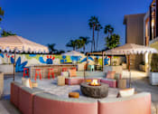 Thumbnail 25 of 34 - A patio with a fire pit and seating area. at The Reserve La Mirada, California, 90638