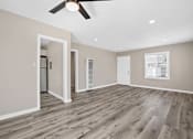 Thumbnail 8 of 10 - an empty living room with a ceiling fan at Huntington Manor Homes Apartment, Huntington Beach, CA