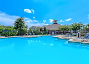 Thumbnail 11 of 16 - A large swimming pool with a depth of 3 feet 6 inches at Addison Park Apartments in Arlington, TX.