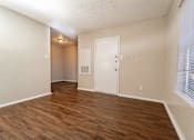 Thumbnail 30 of 38 - Empty living room with hardwood flooring at The Finley Apartments, Texas