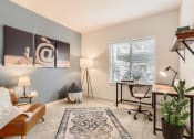 Thumbnail 13 of 51 - Fairview, OR Apartments-Lodges at Lake Salish-Bedroom with Large Window and Carpet Flooring