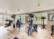 Thumbnail 24 of 51 - Fairview OR Apartments - Lodges at Lake Salish - Resident Fitness Center WIth Ellipticals, Handweights, and Various Other Exercise Machines and Equipment
