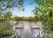 Thumbnail 41 of 51 - Apartments in Fairview for Rent - Serene Dock on the Lake Surrounded by Lush Trees.