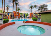Thumbnail 6 of 17 - A round pool with a hot tub in the middle of it.