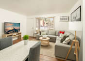 Thumbnail 12 of 13 - A living room with a grey couch, a white dining table and a painting on the wall.