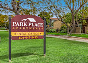 Thumbnail 4 of 13 - A sign for Park Place Apartments with a rental office and phone number.