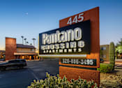 Thumbnail 7 of 13 - A sign for Pantano Crossing Apartments with a phone number on it.