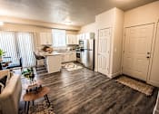 Thumbnail 8 of 45 - A kitchen with a refrigerator, sink, and cabinets.