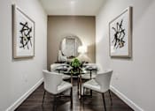Thumbnail 9 of 35 - Open-concept dining room with modern furnishings, designer lighting, and convenient access to the gourmet kitchen.