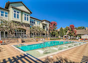Thumbnail 16 of 26 - A large house with a pool in front.