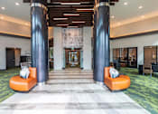 Thumbnail 20 of 35 - Luxury apartment resident lounge with stylish furnishings, natural light, and space for social gatherings.