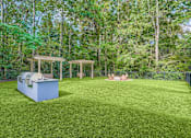 Thumbnail 26 of 39 - A backyard with a grill and a gazebo.
