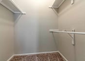 Thumbnail 24 of 38 - A white wall with a white shelf and a white pipe.