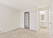 Thumbnail 6 of 24 - A room with a white door and a white cabinet.