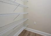 Thumbnail 12 of 31 - Empty white shelves in a room.