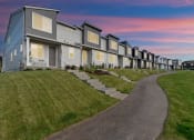 Thumbnail 7 of 46 - Apartments with a sidewalk in front of it at Thrive at Green Mountain, Washington  , 98607
