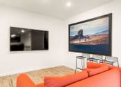 Thumbnail 3 of 16 - Living Area With TV at Nomad Apartments, Oregon, 97217
