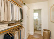 Thumbnail 8 of 13 - A white bathroom with a towel rack and a toilet.