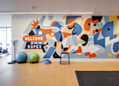 Thumbnail 14 of 78 - A gym with a sign that says "Welcome to the Ropes".