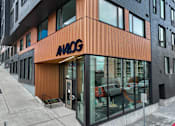 Thumbnail 14 of 19 - the front of an office building with a glass door at Analog Tacoma, Tacoma, Washington