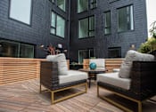 Thumbnail 5 of 19 - a patio with chairs and a table in front of a building at Analog Tacoma, Tacoma