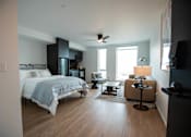 Thumbnail 1 of 19 - a bedroom with a bed and a living room with a window at Analog Tacoma, Washington 98402