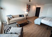 Thumbnail 6 of 19 - a living room with a couch and a bed at Analog Tacoma, Washington