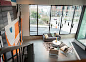 Thumbnail 10 of 19 - a living room with couches and a table in a building with large windows at Analog Tacoma, Tacoma, WA, 98402