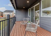 Thumbnail 37 of 46 - Outdoor patio with a chair and table at Thrive at Green Mountain, Camas, WA, 98607