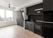 Thumbnail 8 of 16 - Black Appliances at Nomad Apartments, Portland