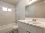 Thumbnail 11 of 18 - a bathroom with a sink toilet and bathtub
