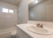 Thumbnail 6 of 18 - a bathroom with a sink and a toilet