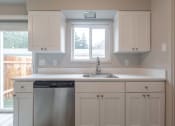 Thumbnail 9 of 18 - a kitchen with a sink and a window