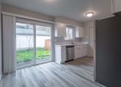 Thumbnail 2 of 18 - a kitchen and a living room with a sliding glass door
