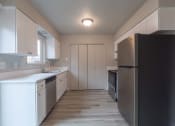 Thumbnail 15 of 18 - a kitchen with a refrigerator freezer and a stove top oven