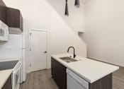 Thumbnail 2 of 24 - a kitchen with a sink and a dishwasher