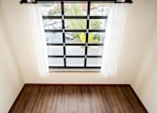 Thumbnail 12 of 27 - A window overlooking a parking lot at Atomic Orchard Experiment, Portland, 97232