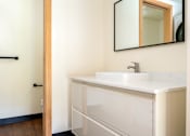Thumbnail 24 of 27 - White sink with a mirror above it at Atomic Orchard Experiment, Oregon