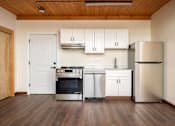 Thumbnail 4 of 27 - Kitchen with refrigerator at Atomic Orchard Experiment, Portland