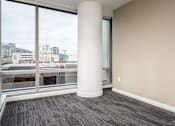 Thumbnail 56 of 78 - A room with a large window and a pillar.