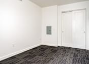 Thumbnail 54 of 78 - A room with a grey carpet and a white door.