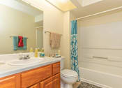 Thumbnail 18 of 34 - a bathroom with a sink toilet and bathtub at Arbors at Windsor Lake, South Carolina, 29223
