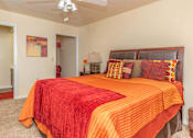 Thumbnail 13 of 34 - a bedroom with a bed and a ceiling fan at Arbors at Windsor Lake, Columbia, SC 29223  